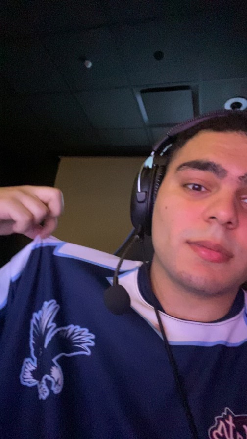 This picture is a selfie of the author, Samer Bishay, wearing his UMW eSports Jersey during his first collegiate match.